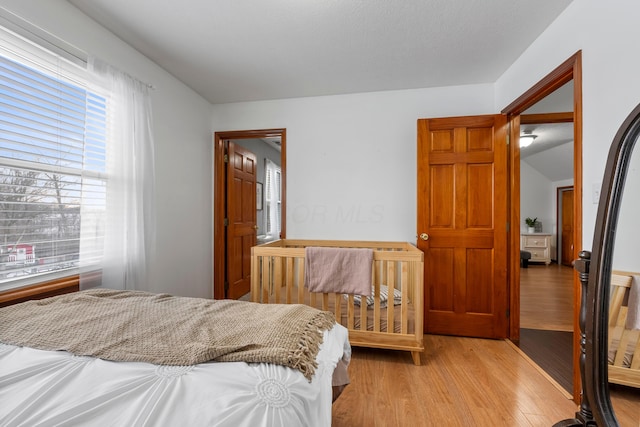 bedroom featuring light wood-style flooring