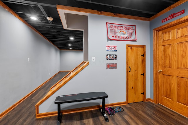 interior space with baseboards and wood finished floors
