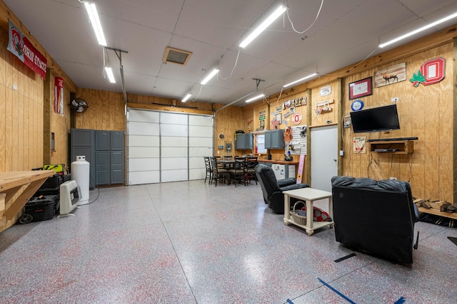 garage featuring wooden walls