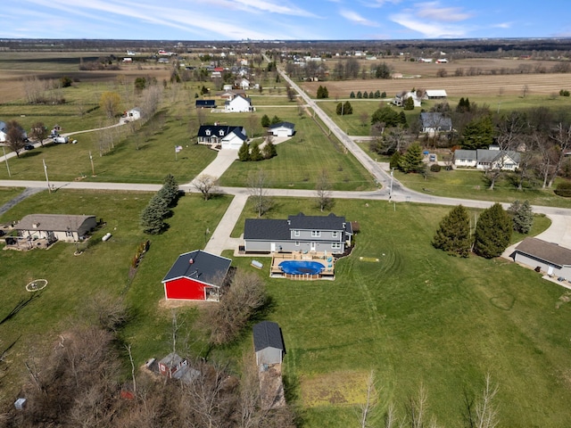 birds eye view of property with a rural view
