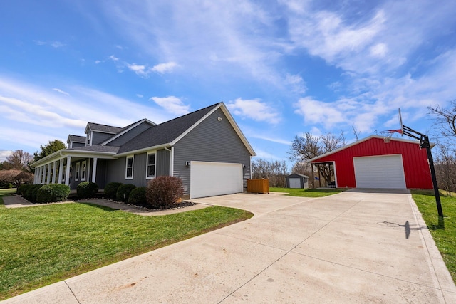 view of side of home with an outbuilding, driveway, roof with shingles, and a lawn