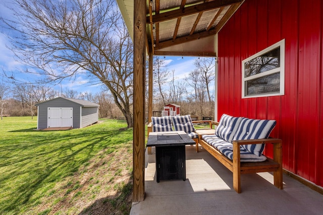 view of patio with an outbuilding, an outdoor hangout area, and a shed