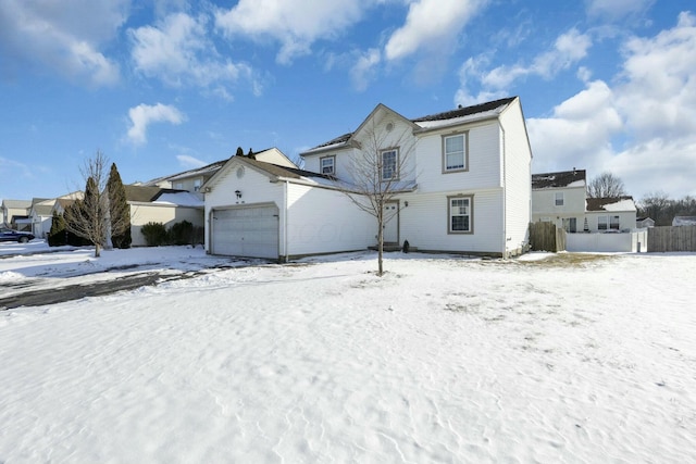 view of front of house with a garage and a residential view