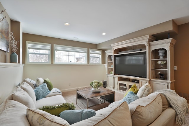 living room with recessed lighting, carpet, visible vents, and baseboards