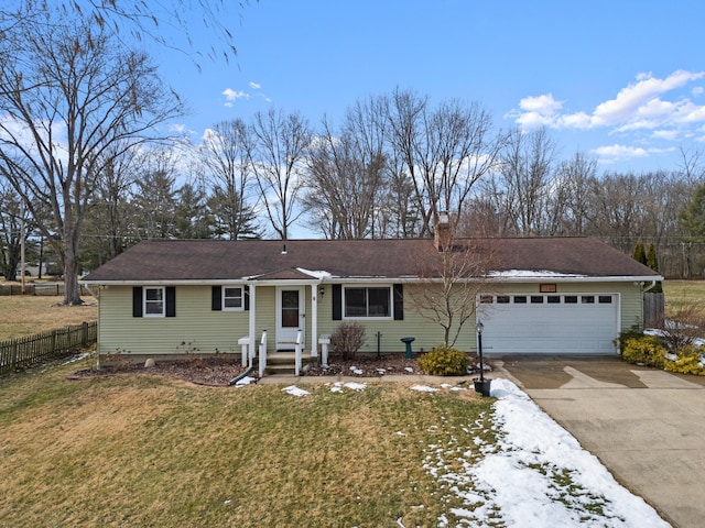 ranch-style house with a front yard, fence, driveway, and an attached garage