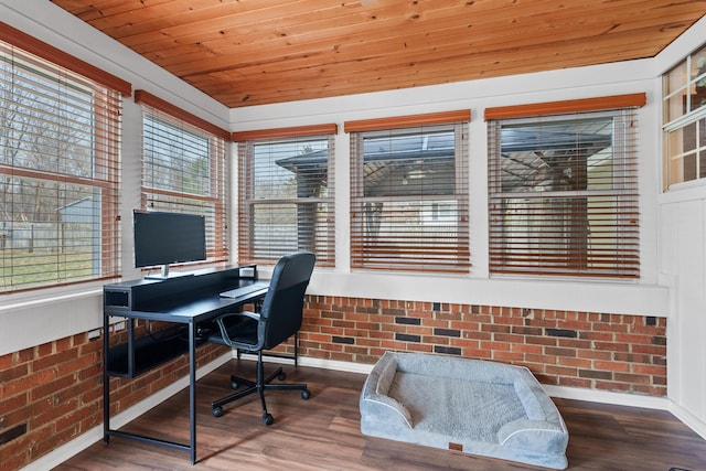 office space with wooden ceiling, brick wall, and wood finished floors