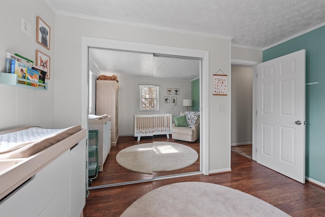 interior space with dark wood-style flooring, crown molding, and a textured ceiling