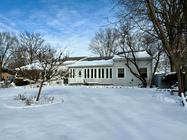 view of front of home featuring a sunroom