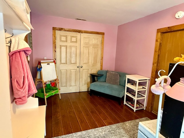 interior space featuring visible vents and wood finished floors