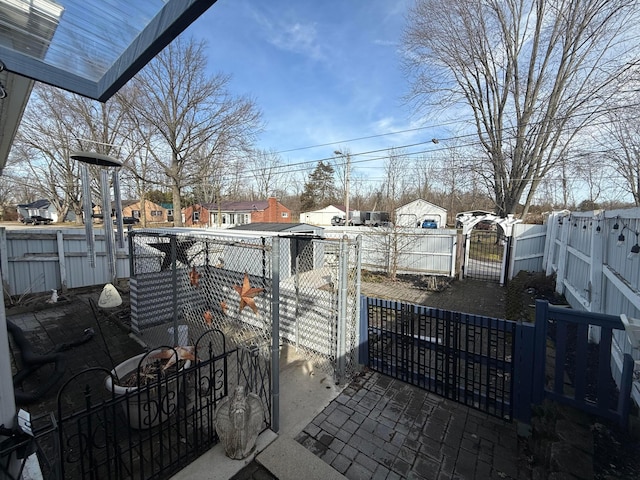 exterior space with fence private yard and a gate