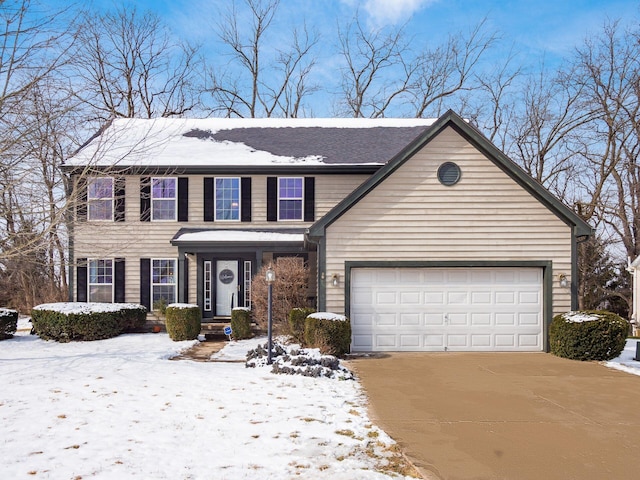 view of front of home with a garage and driveway