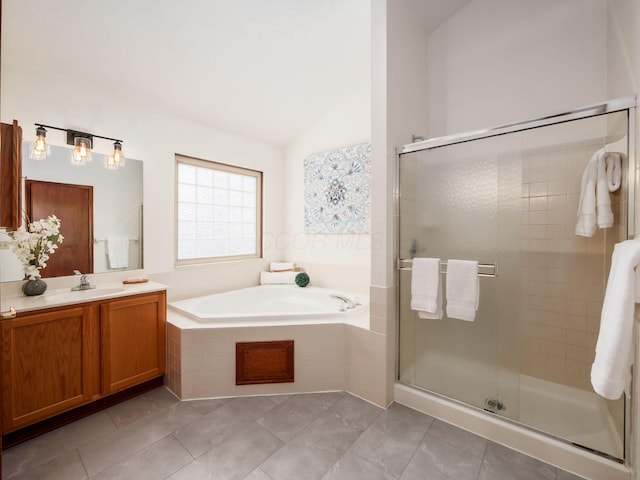 full bathroom featuring lofted ceiling, a garden tub, tile patterned flooring, vanity, and a shower stall