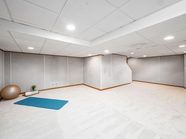 exercise room with a decorative wall, recessed lighting, visible vents, and light colored carpet