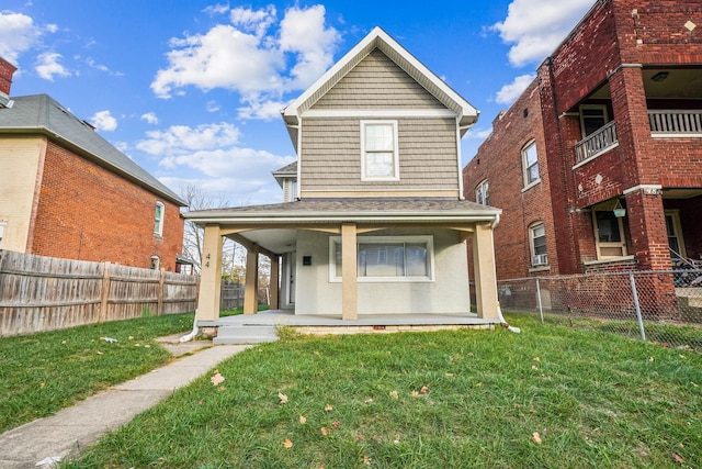 view of front of property featuring covered porch and a front yard