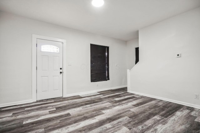 foyer entrance featuring dark hardwood / wood-style flooring