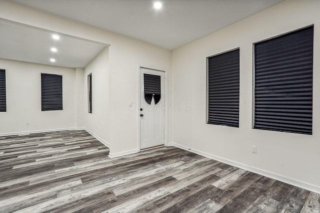 spare room with dark hardwood / wood-style flooring