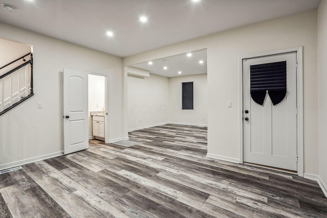 empty room with dark hardwood / wood-style flooring