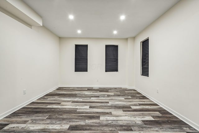 empty room with dark hardwood / wood-style floors