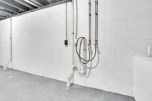 details featuring concrete block wall and concrete flooring