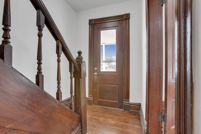 entrance foyer with stairway and dark wood finished floors