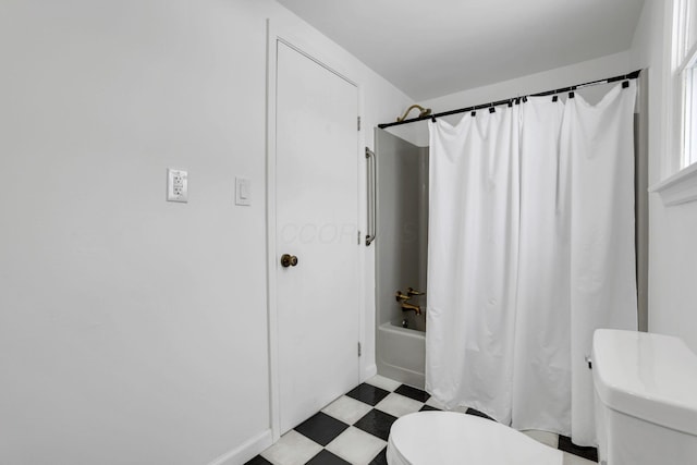 full bath with toilet, shower / bath combo, and tile patterned floors