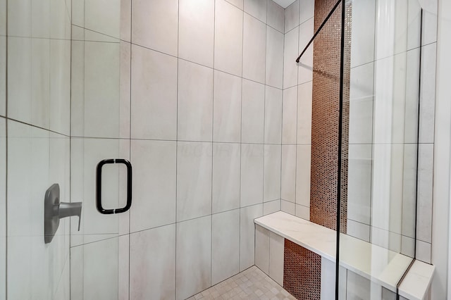 full bathroom with a tile shower