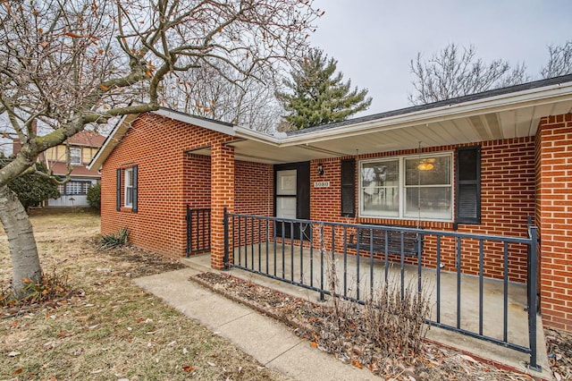 view of front of house with brick siding