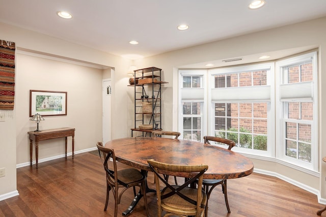 dining area featuring recessed lighting, visible vents, and wood finished floors