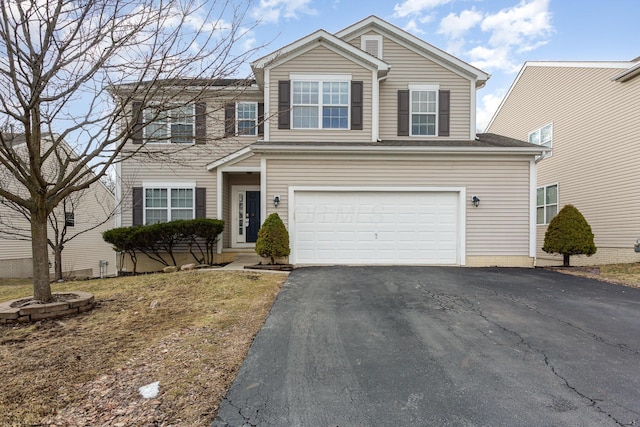 traditional-style house with driveway and a garage