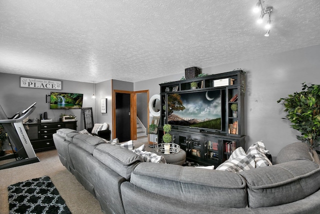 carpeted living area featuring stairs and a textured ceiling