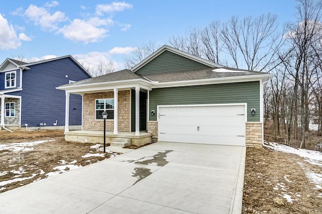 view of front of home featuring a shingled roof, a porch, concrete driveway, an attached garage, and stone siding