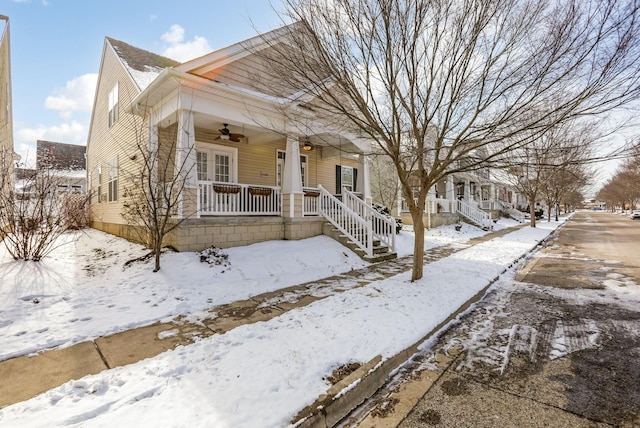 bungalow-style home featuring ceiling fan and a porch