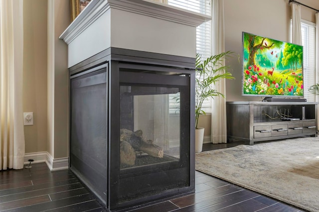 room details featuring baseboards and wood finished floors