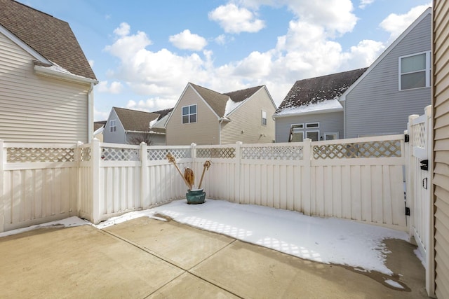 view of patio / terrace with a residential view and a fenced backyard