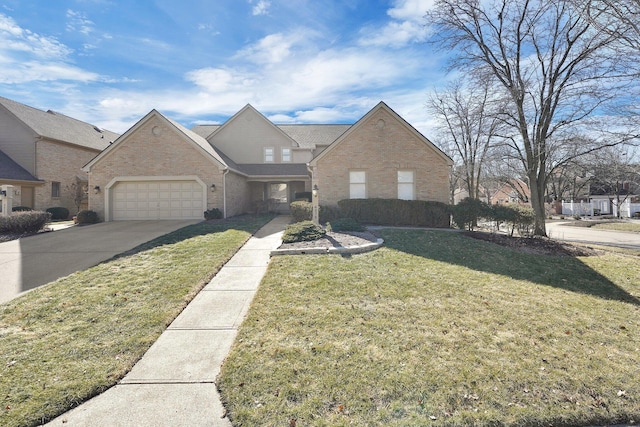 traditional home featuring a front yard, concrete driveway, brick siding, and an attached garage