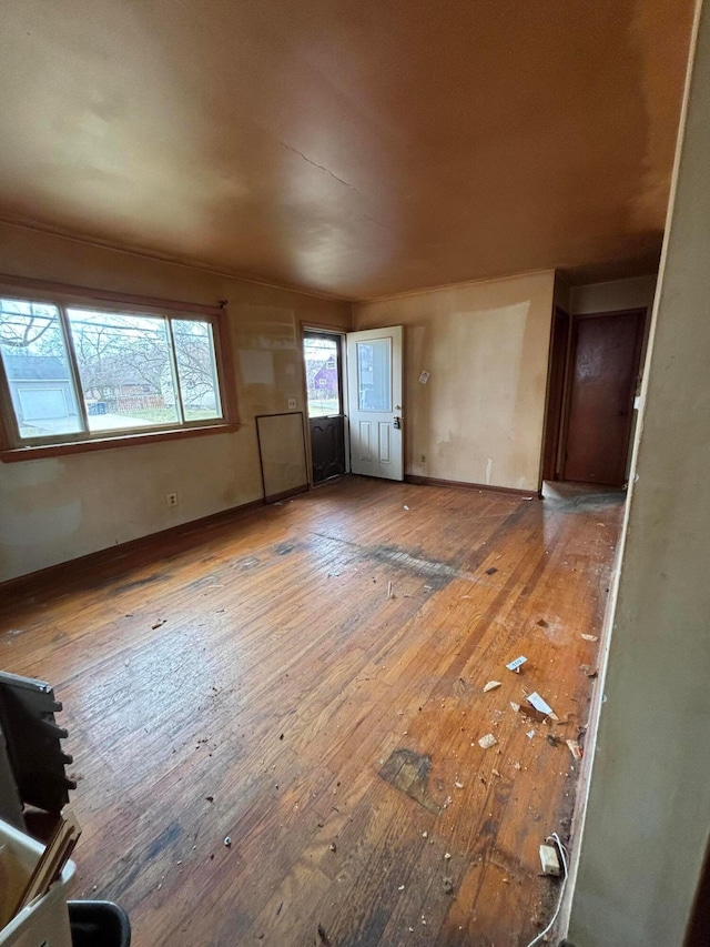 unfurnished living room with hardwood / wood-style flooring