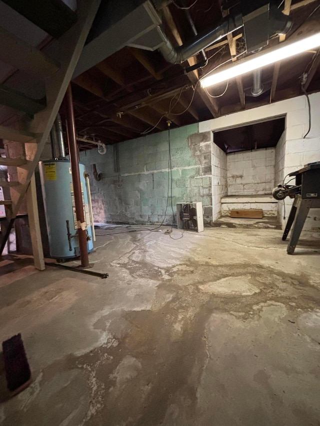 unfinished basement with gas water heater