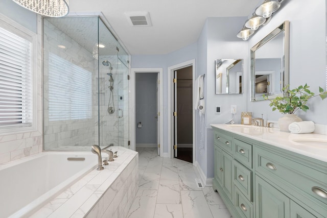 full bath with a sink, visible vents, a stall shower, a bath, and marble finish floor