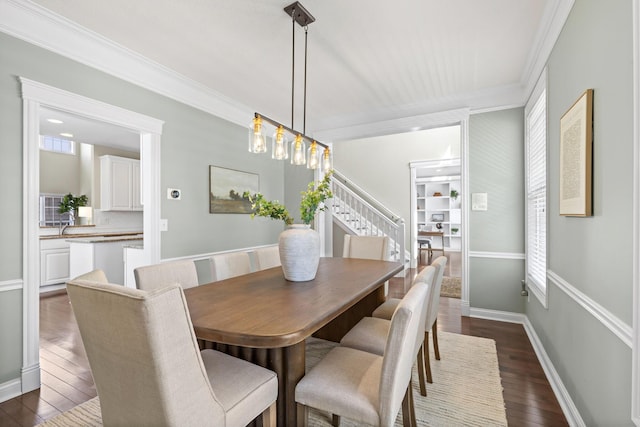 dining area featuring ornamental molding, baseboards, stairway, and dark wood-type flooring