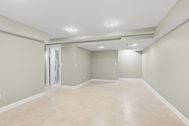finished basement featuring recessed lighting and baseboards