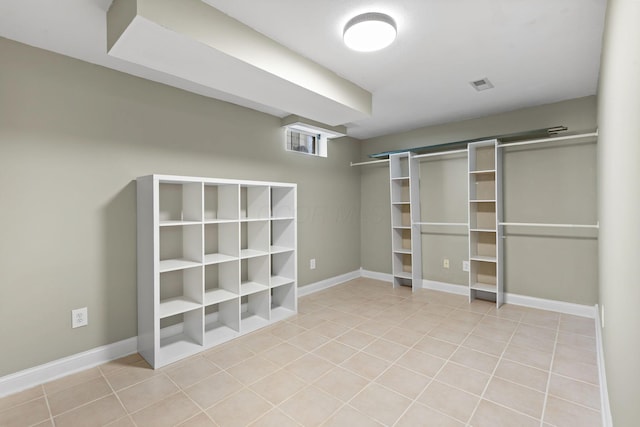 spacious closet with visible vents and light tile patterned floors