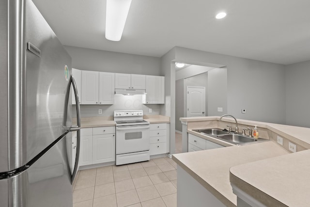 kitchen with a sink, light tile patterned flooring, electric range, freestanding refrigerator, and under cabinet range hood