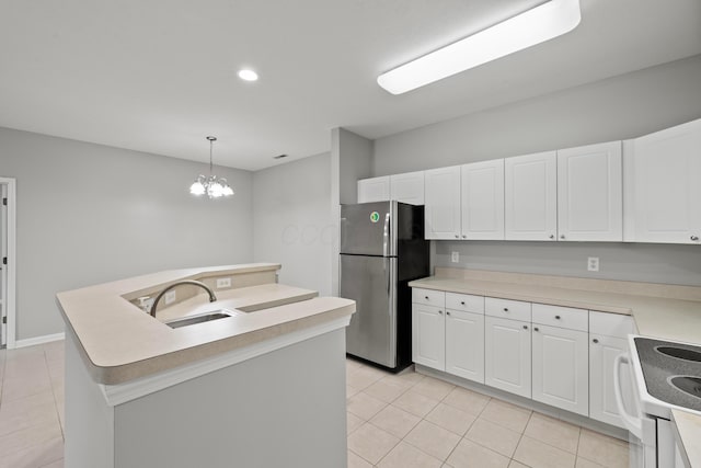 kitchen featuring a sink, light tile patterned flooring, freestanding refrigerator, a center island with sink, and electric range