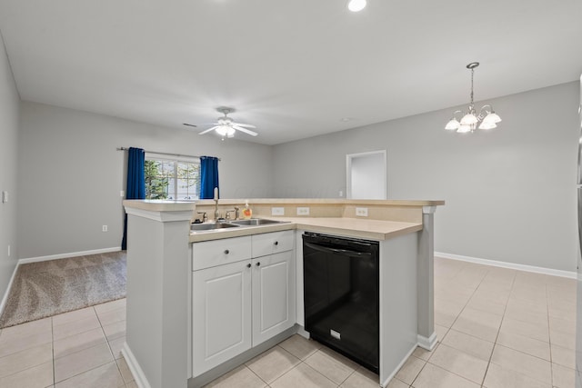 kitchen featuring a sink, ceiling fan with notable chandelier, light tile patterned floors, light countertops, and black dishwasher
