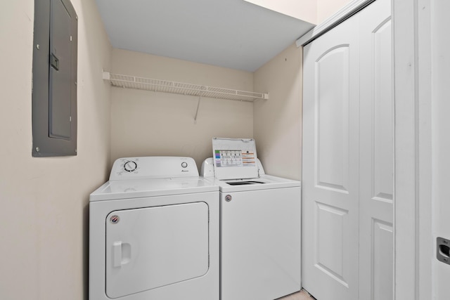 laundry area featuring washing machine and dryer, electric panel, and laundry area