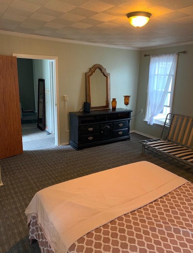 bedroom featuring dark carpet and crown molding