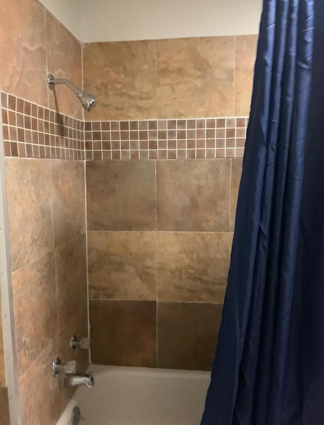 bathroom featuring shower / bath combination with curtain