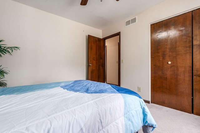 bedroom featuring visible vents, ceiling fan, and carpet flooring