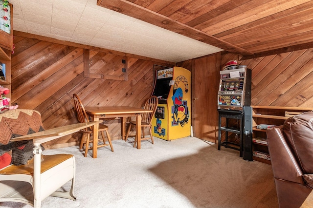 interior space with wooden ceiling, carpet, and wooden walls