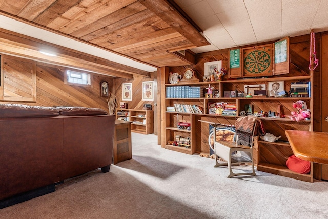 interior space with carpet floors, wood walls, and wood ceiling